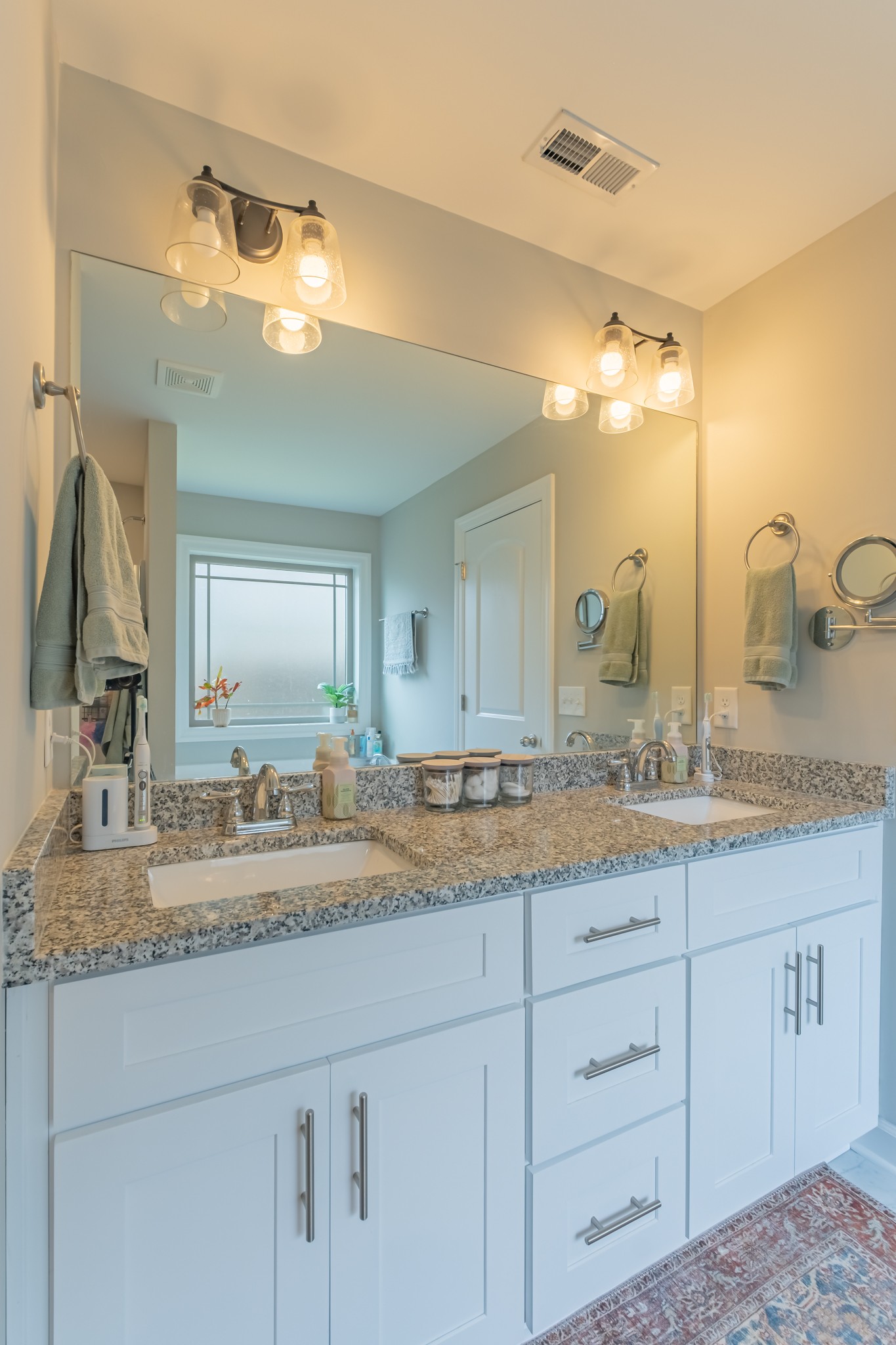 296 Spring Breeze Drive Tullahoma, TN 37388 - Photo 18 of 31 a bathroom with a granite countertop double vanity sink and mirror