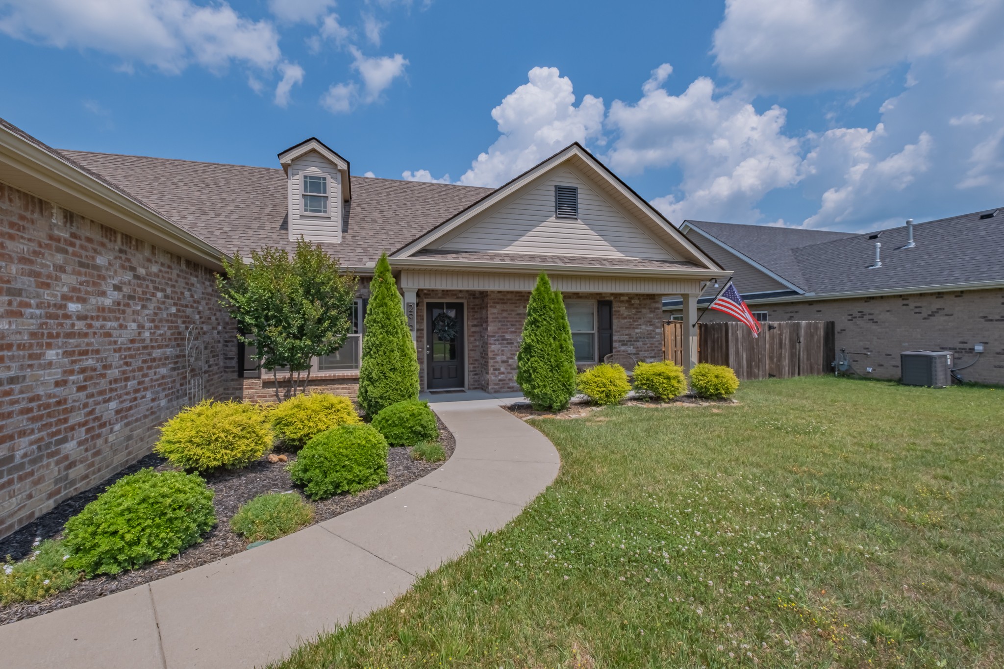 296 Spring Breeze Drive Tullahoma, TN 37388 - Photo 2 of 31 a front view of a house with garden