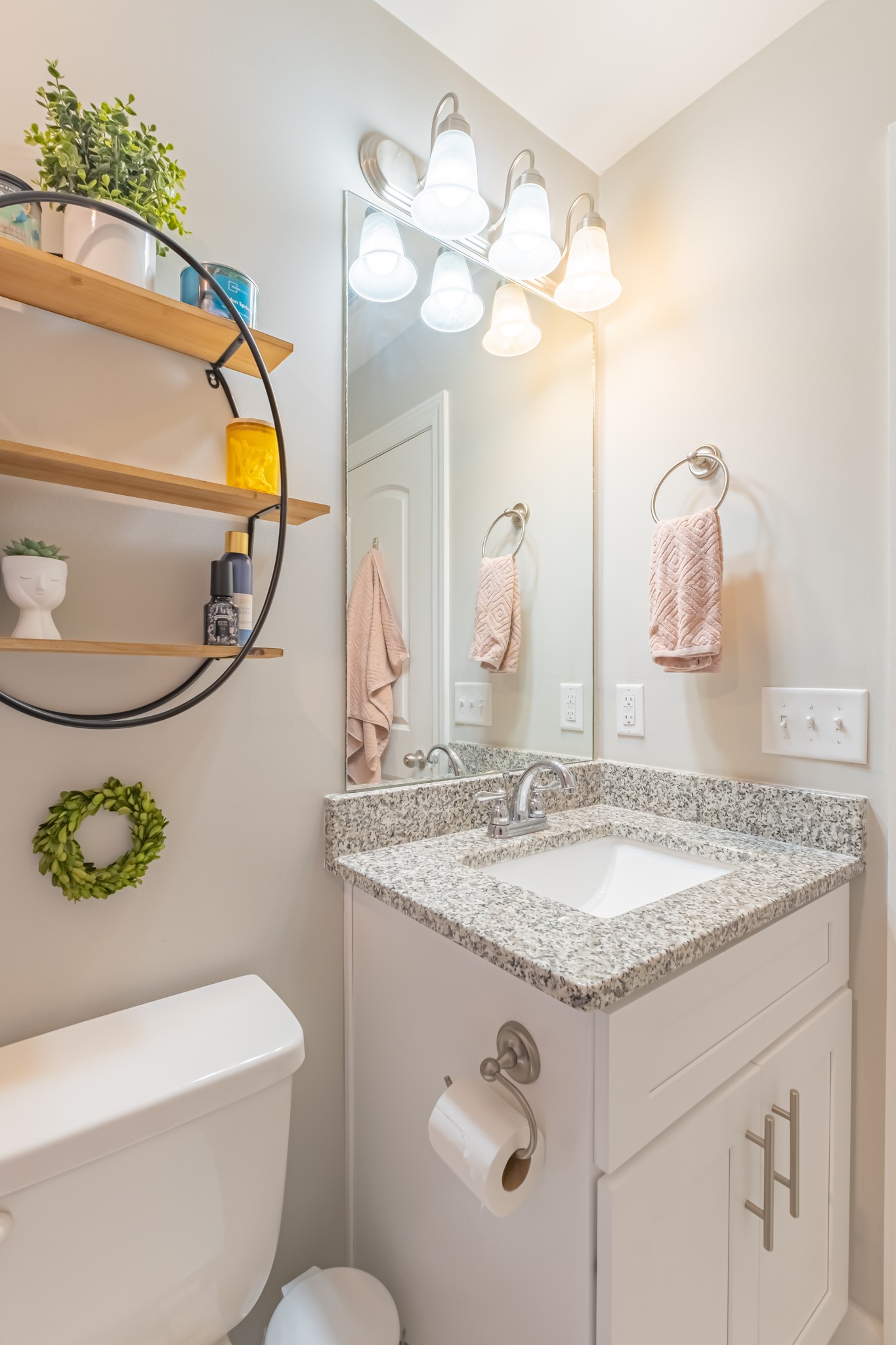 296 Spring Breeze Drive Tullahoma, TN 37388 - Photo 25 of 31 a bathroom with a granite countertop toilet sink and mirror