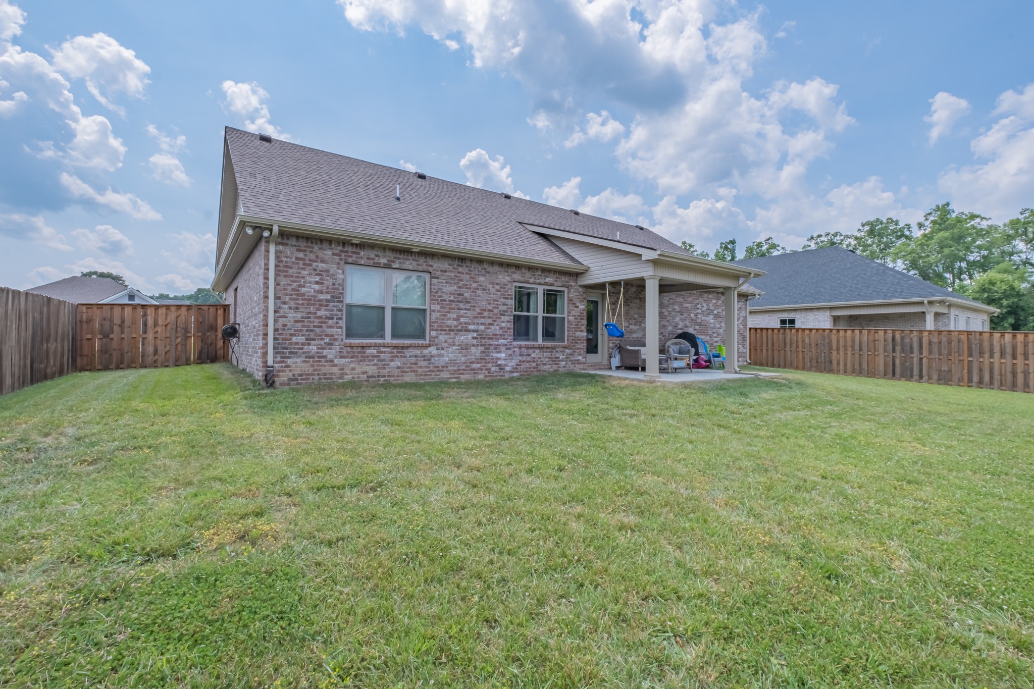 296 Spring Breeze Drive Tullahoma, TN 37388 - Photo 31 of 31 a view of a house with a yard and sitting area