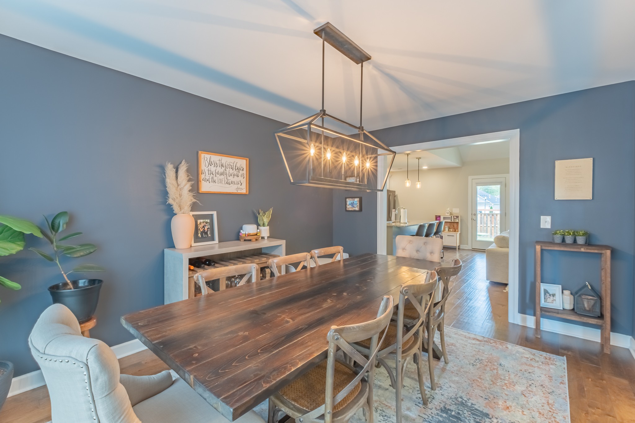 296 Spring Breeze Drive Tullahoma, TN 37388 - Photo 5 of 31 a dining room with furniture a chandelier and wooden floor