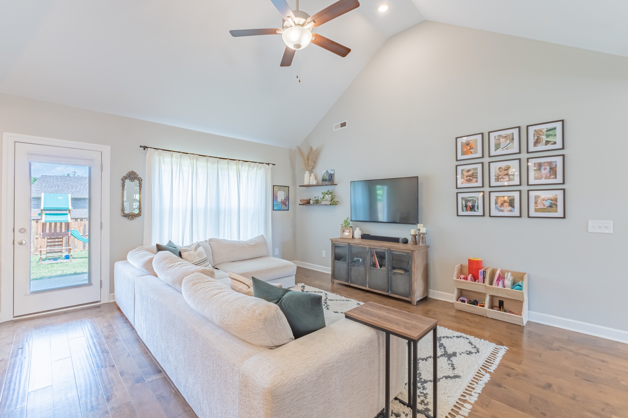 296 Spring Breeze Drive Tullahoma, TN 37388 - Photo 8 of 31 a living room with furniture and a flat screen tv