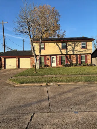 a view of house with yard