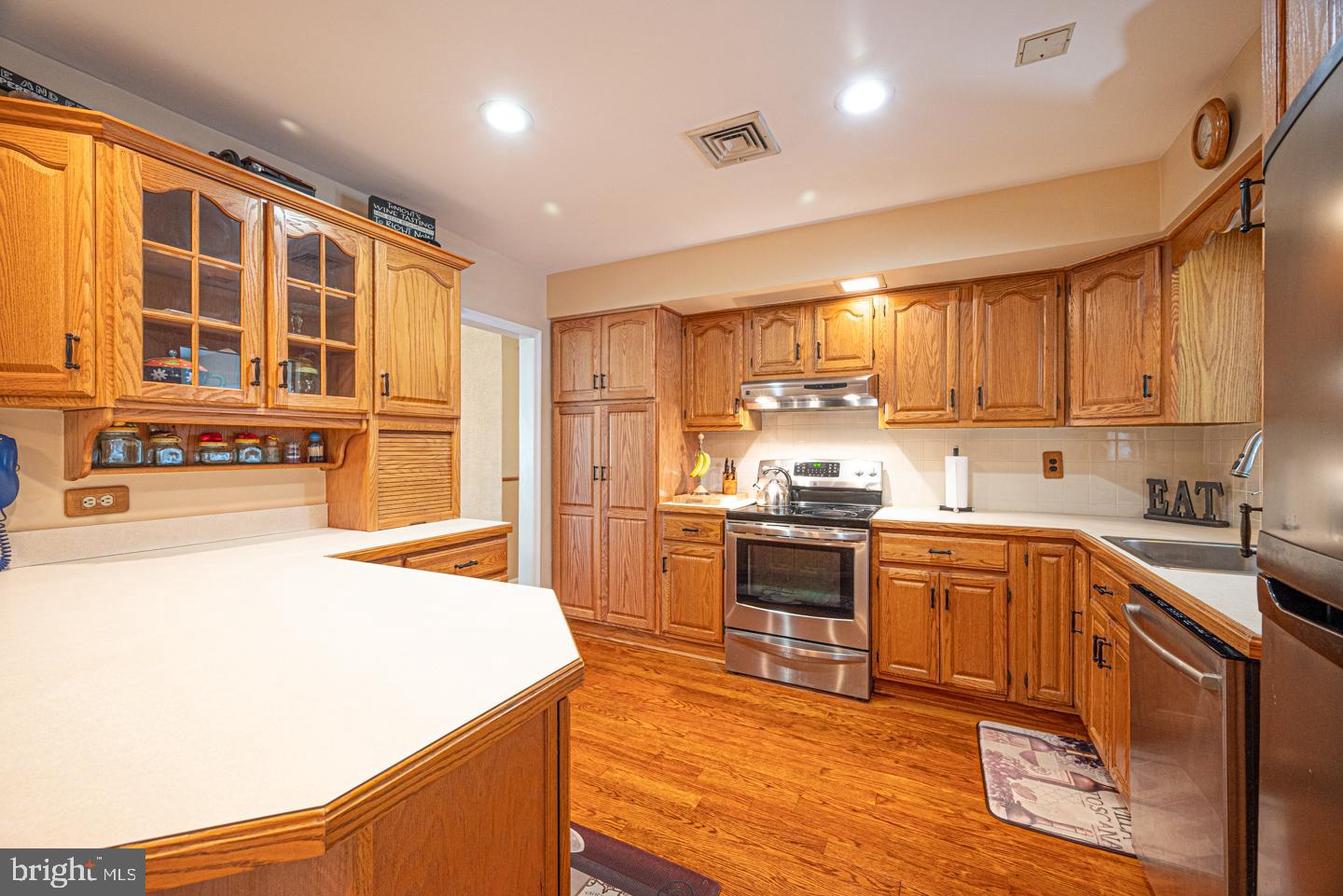 8 Devon Lane Media, PA 19063 - Photo 20 of 75 a kitchen with stainless steel appliances granite countertop a stove and a refrigerator