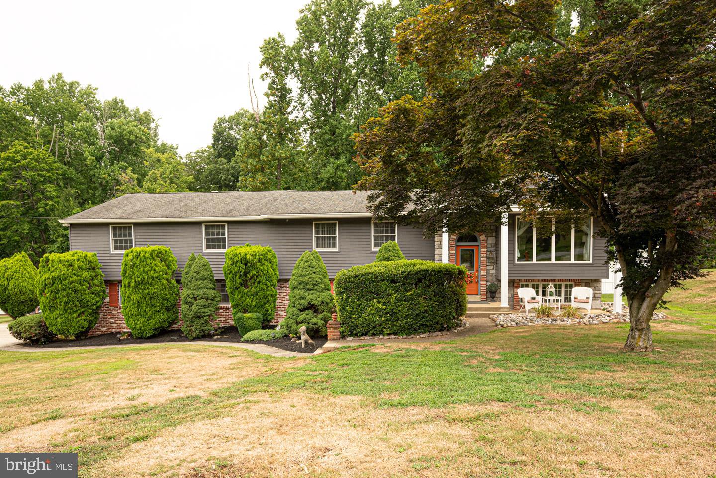 8 Devon Lane Media, PA 19063 - Photo 2 of 75 a front view of a house with a yard