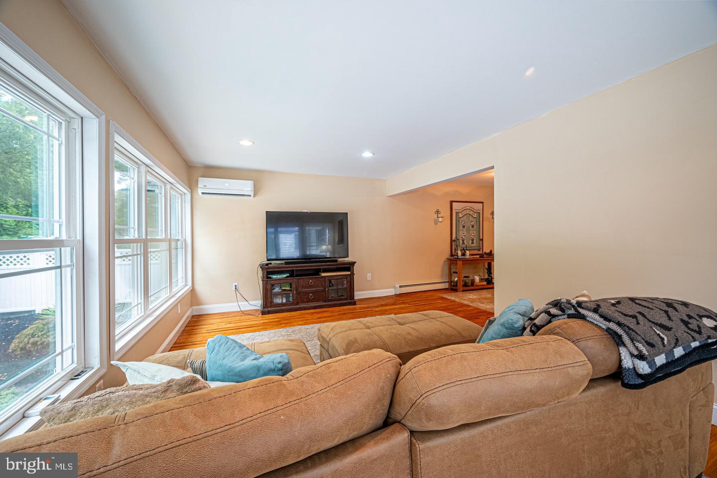 8 Devon Lane Media, PA 19063 - Photo 26 of 75 a living room with furniture a flat screen tv and a large window