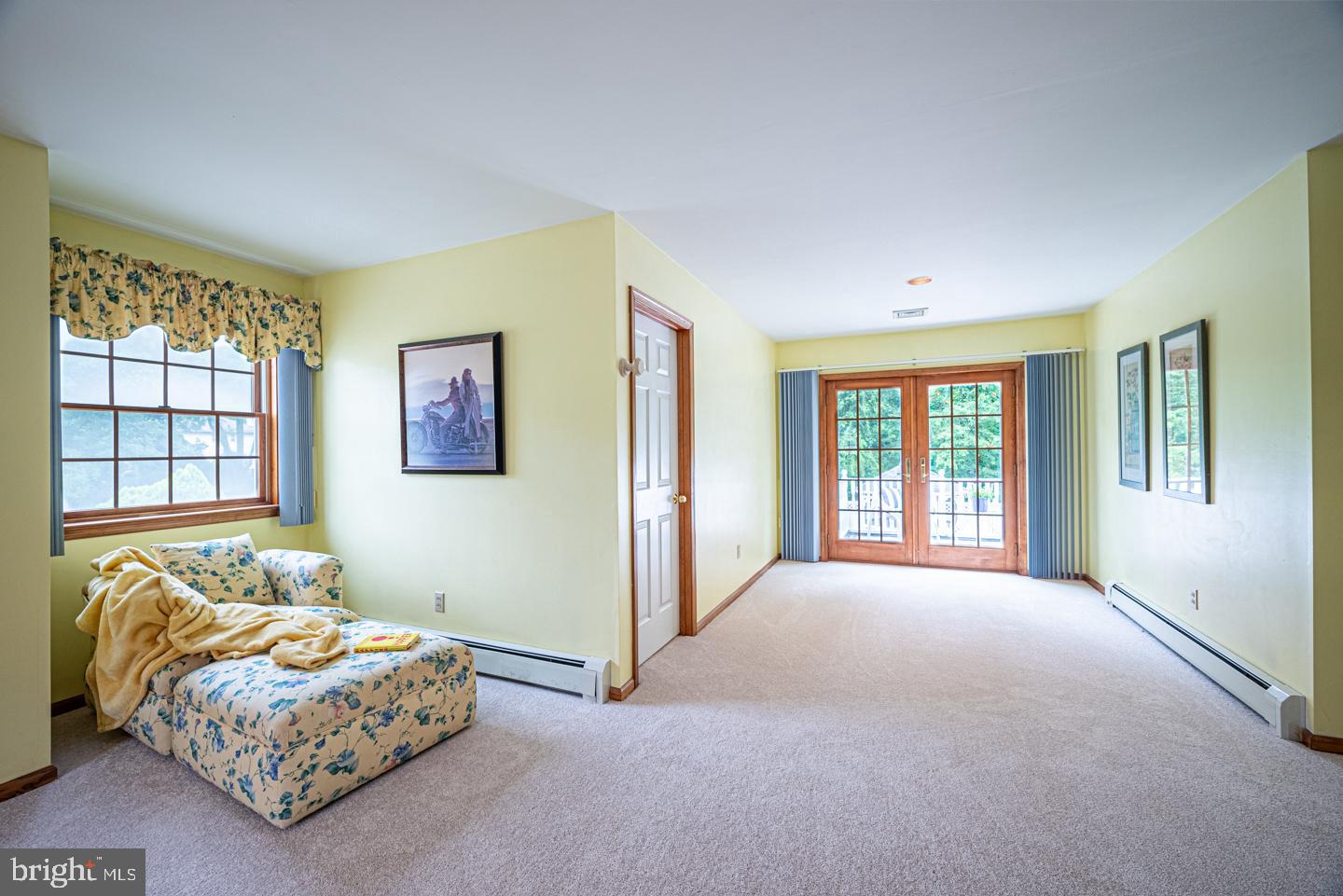 8 Devon Lane Media, PA 19063 - Photo 41 of 75 a spacious bedroom with a bed and a couch