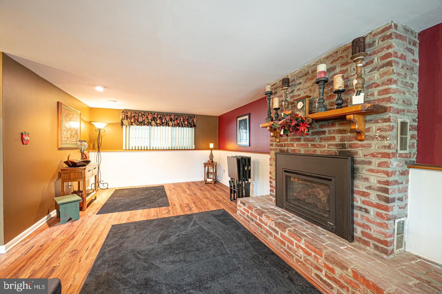 8 Devon Lane Media, PA 19063 - Photo 48 of 75 a living room with a fireplace and a flat screen tv