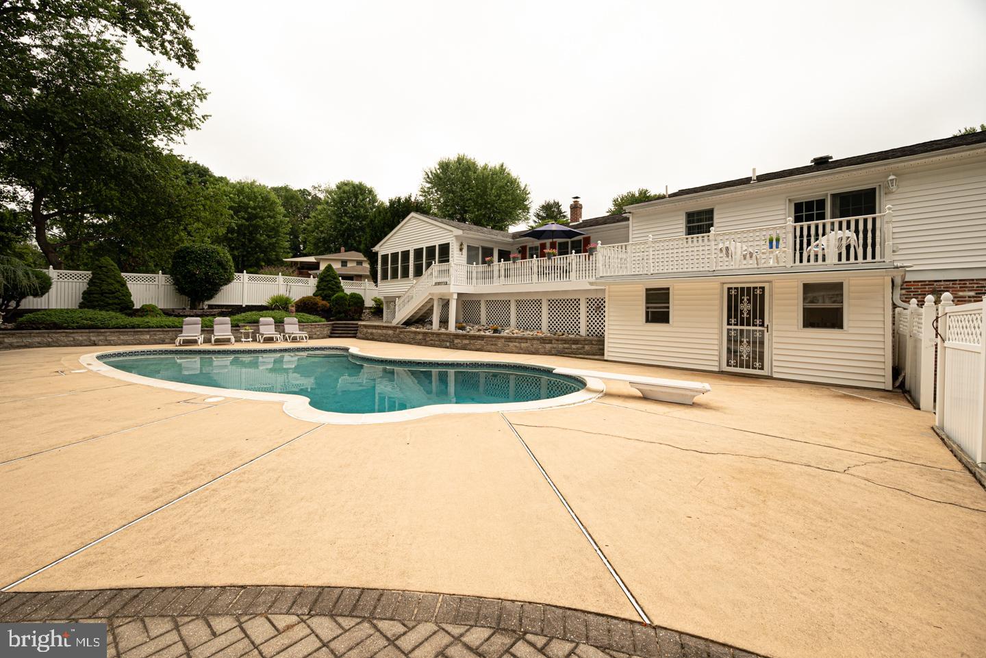 8 Devon Lane Media, PA 19063 - Photo 60 of 75 a view of a white house with a swimming pool