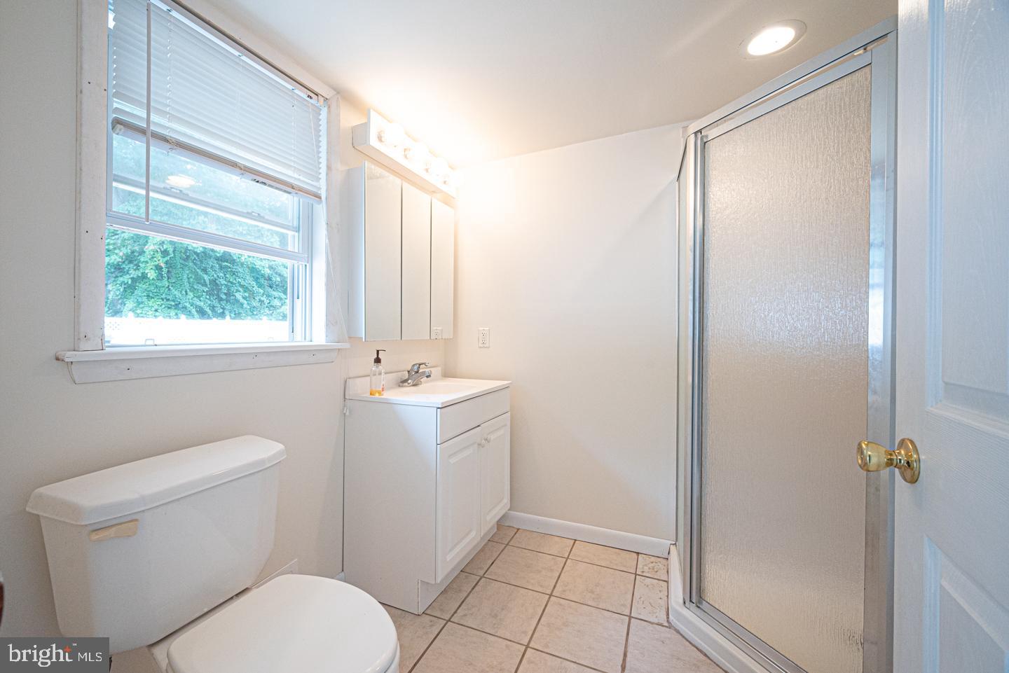 8 Devon Lane Media, PA 19063 - Photo 65 of 75 a bathroom with a sink a toilet and shower