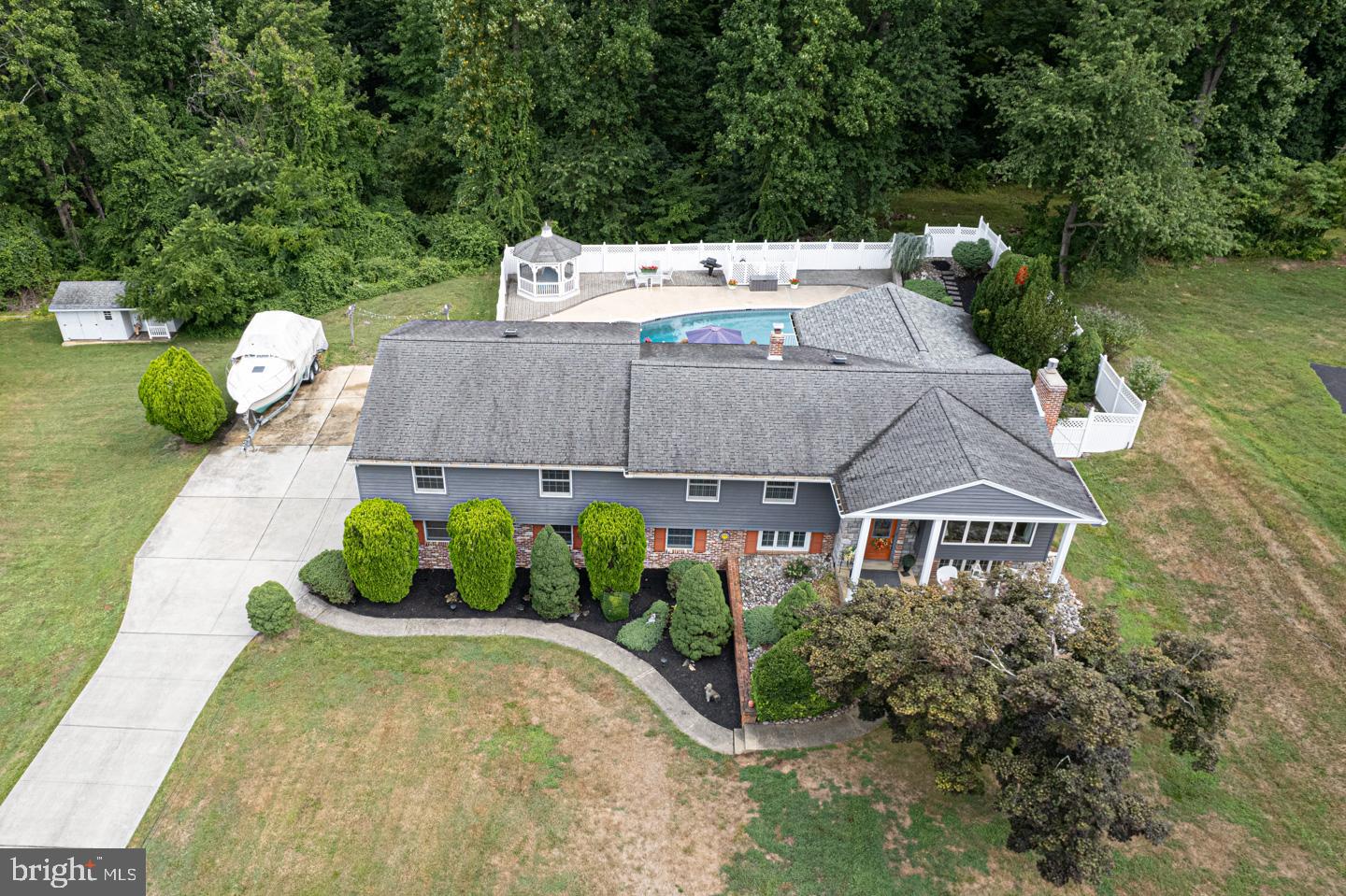 8 Devon Lane Media, PA 19063 - Photo 67 of 75 a aerial view of a house with a yard and potted plants