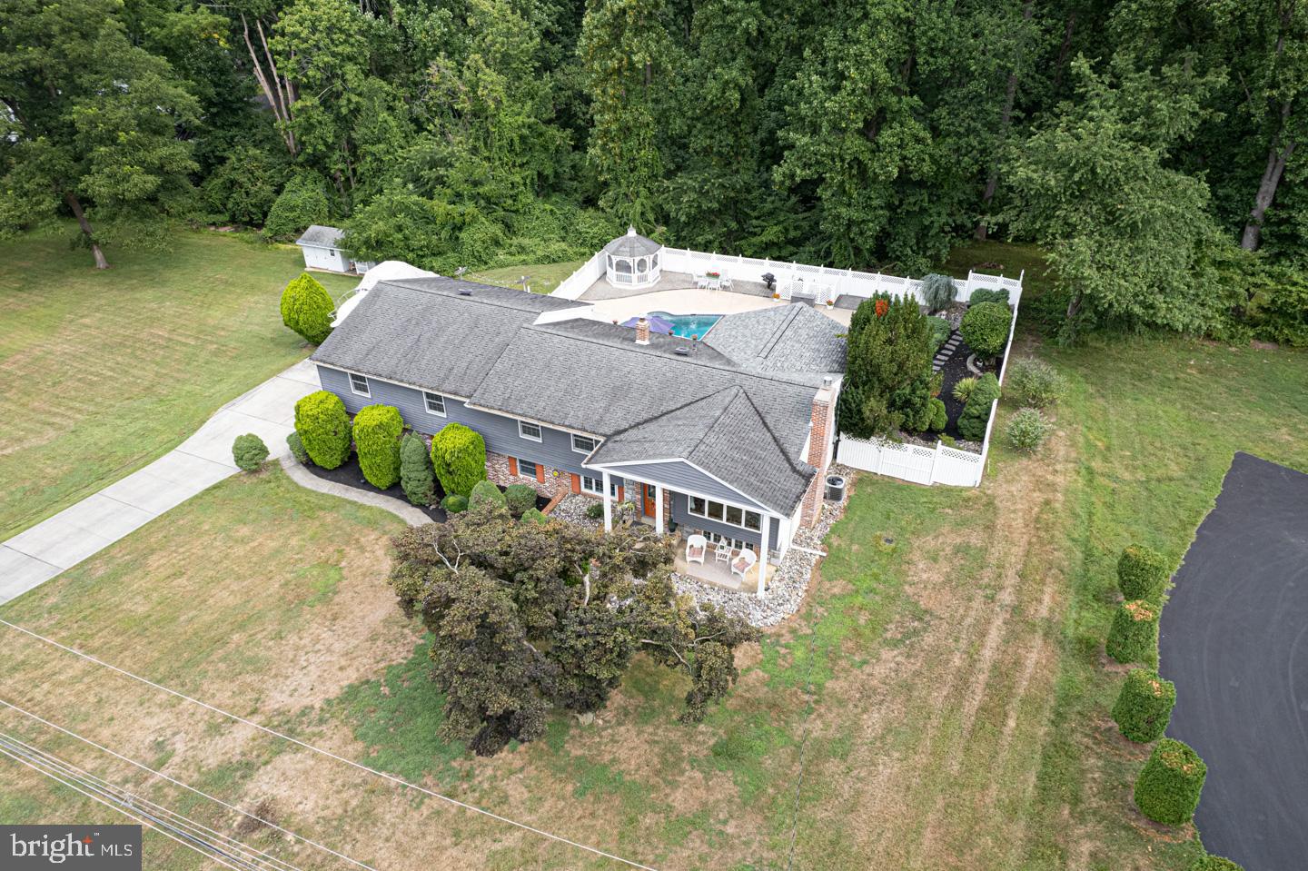 8 Devon Lane Media, PA 19063 - Photo 68 of 75 an aerial view of a house with pool a yard and lake view