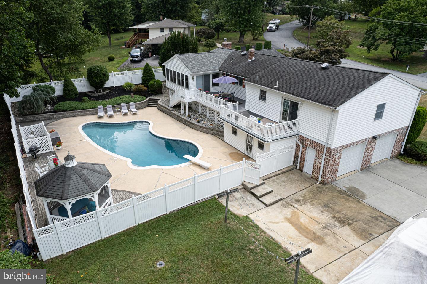 8 Devon Lane Media, PA 19063 - Photo 72 of 75 an aerial view of a house with swimming pool and a yard