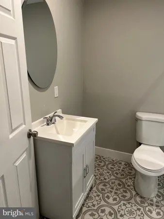 a bathroom with a shower and a sink