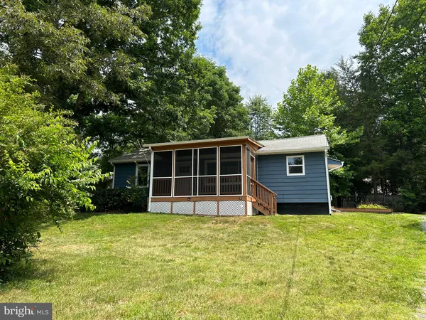 a view of balcony with wooden floor
