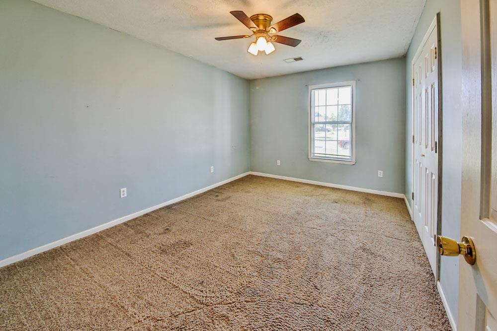 314 Wayne Avenue Ripley, TN 38063 - Photo 17 of 23 an empty room with windows and fan