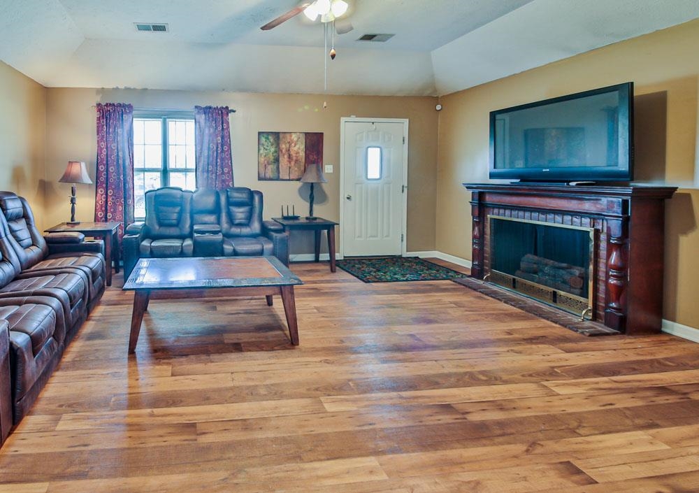 314 Wayne Avenue Ripley, TN 38063 - Photo 4 of 23 a living room with furniture and a fireplace