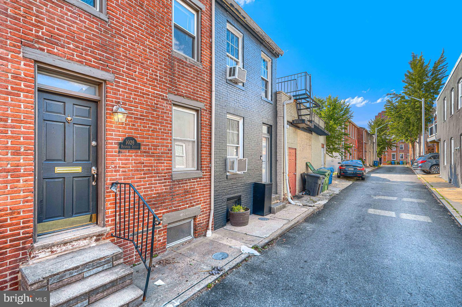 1026 Patapsco Street Baltimore, MD 21230 - Photo 2 of 24 a view of a brick house with many windows