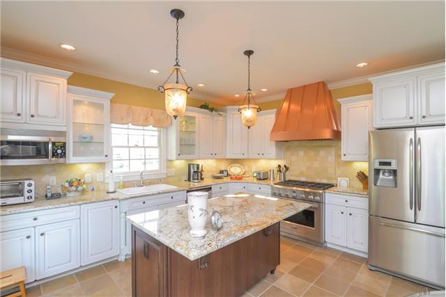 2427 Mann Road Lebanon, TN 37087 - Photo 5 of 18 a kitchen with stainless steel appliances granite countertop a sink a stove a refrigerator a center island and cabinets