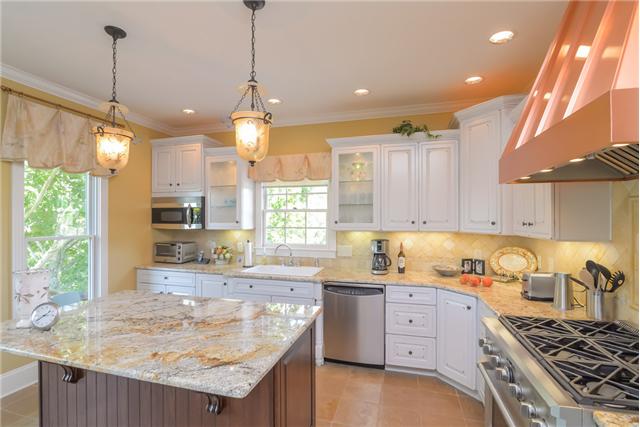 2427 Mann Road Lebanon, TN 37087 - Photo 6 of 18 a kitchen with granite countertop a sink a counter space appliances and cabinets
