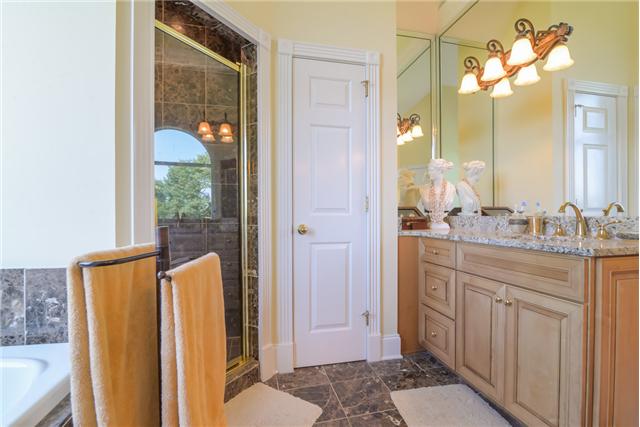 2427 Mann Road Lebanon, TN 37087 - Photo 9 of 18 a bathroom with a granite countertop sink and a mirror