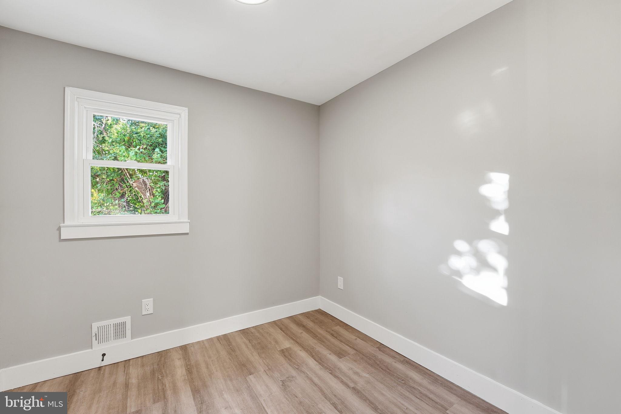 5716 Somerset Road Riverdale, MD 20737 - Photo 15 of 24 an empty room with a window