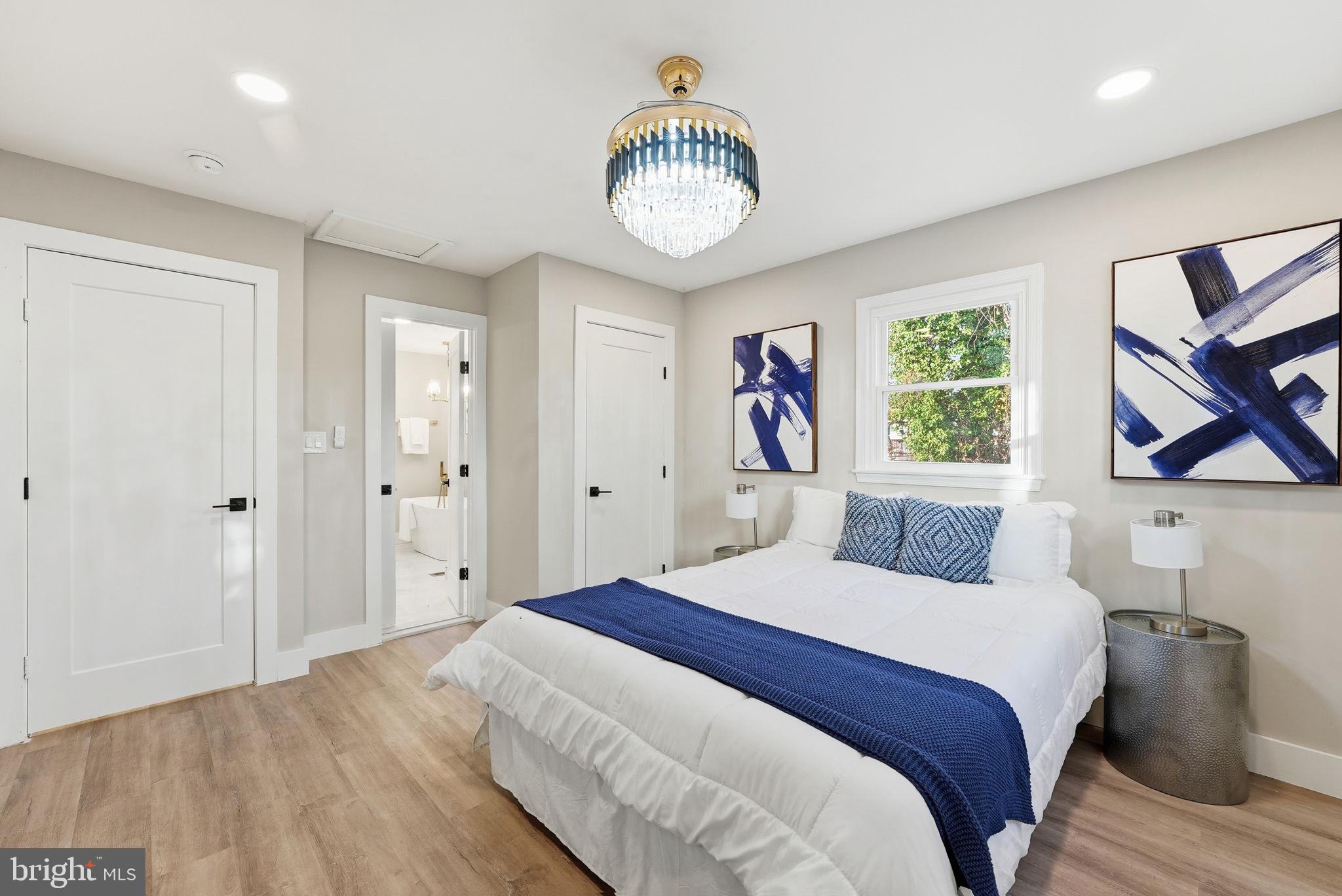 5716 Somerset Road Riverdale, MD 20737 - Photo 8 of 24 a bedroom with a bed and a window