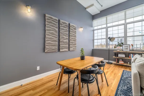 a view of a dining room with furniture and window