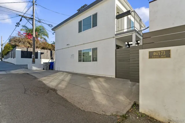 a view of a street with a building in the background