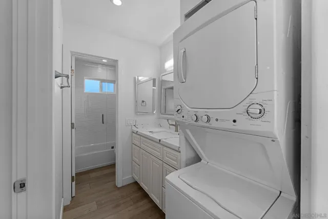 a bathroom with a double vanity sink mirror and toilet