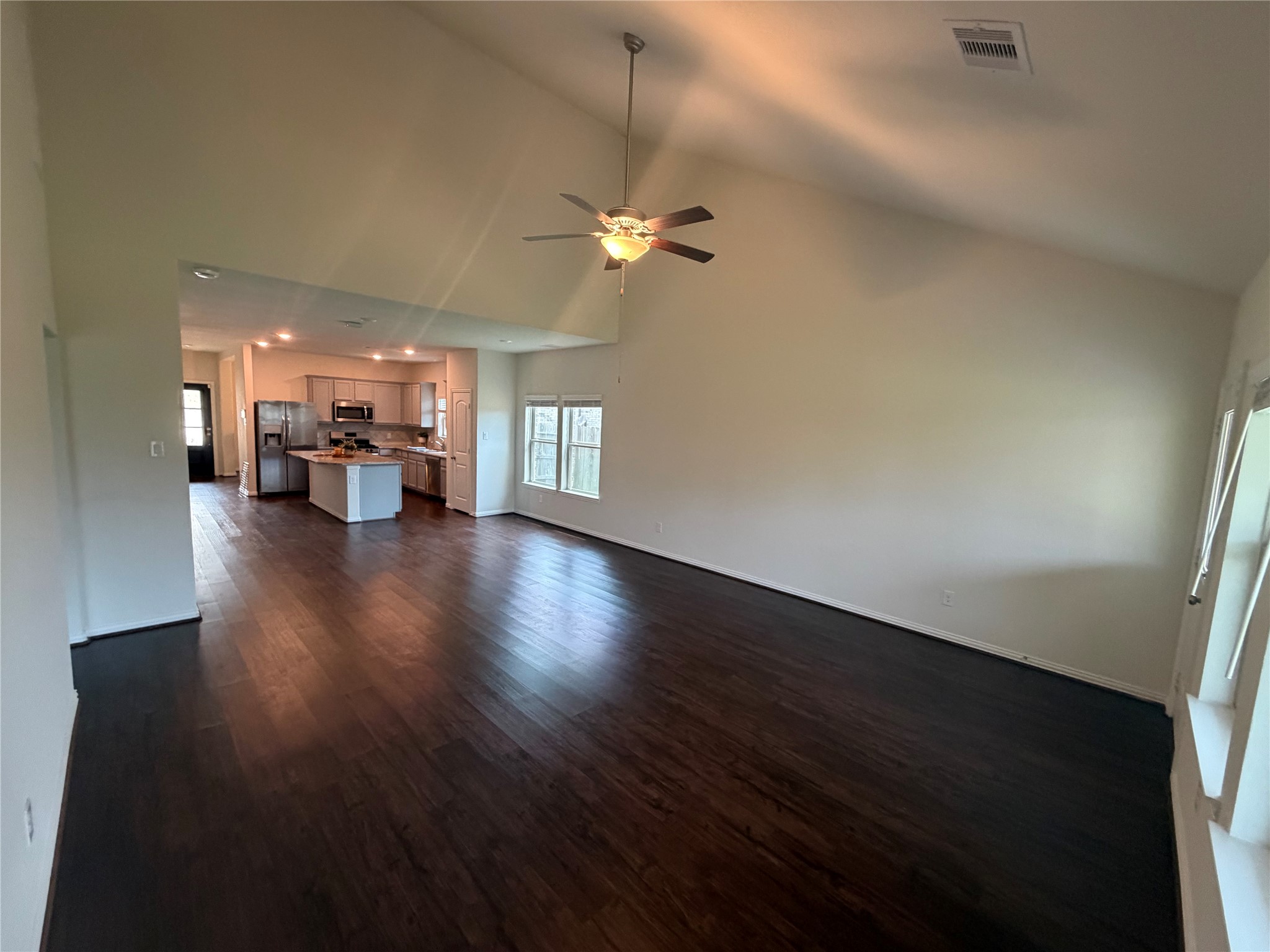 4706 Walnut Willow Ct Spring Spring, TX 77386 - Photo 8 of 17 a view of a livingroom with hardwood floor and a ceiling fan
