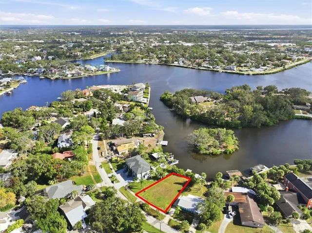 an aerial view of a house with a lake view