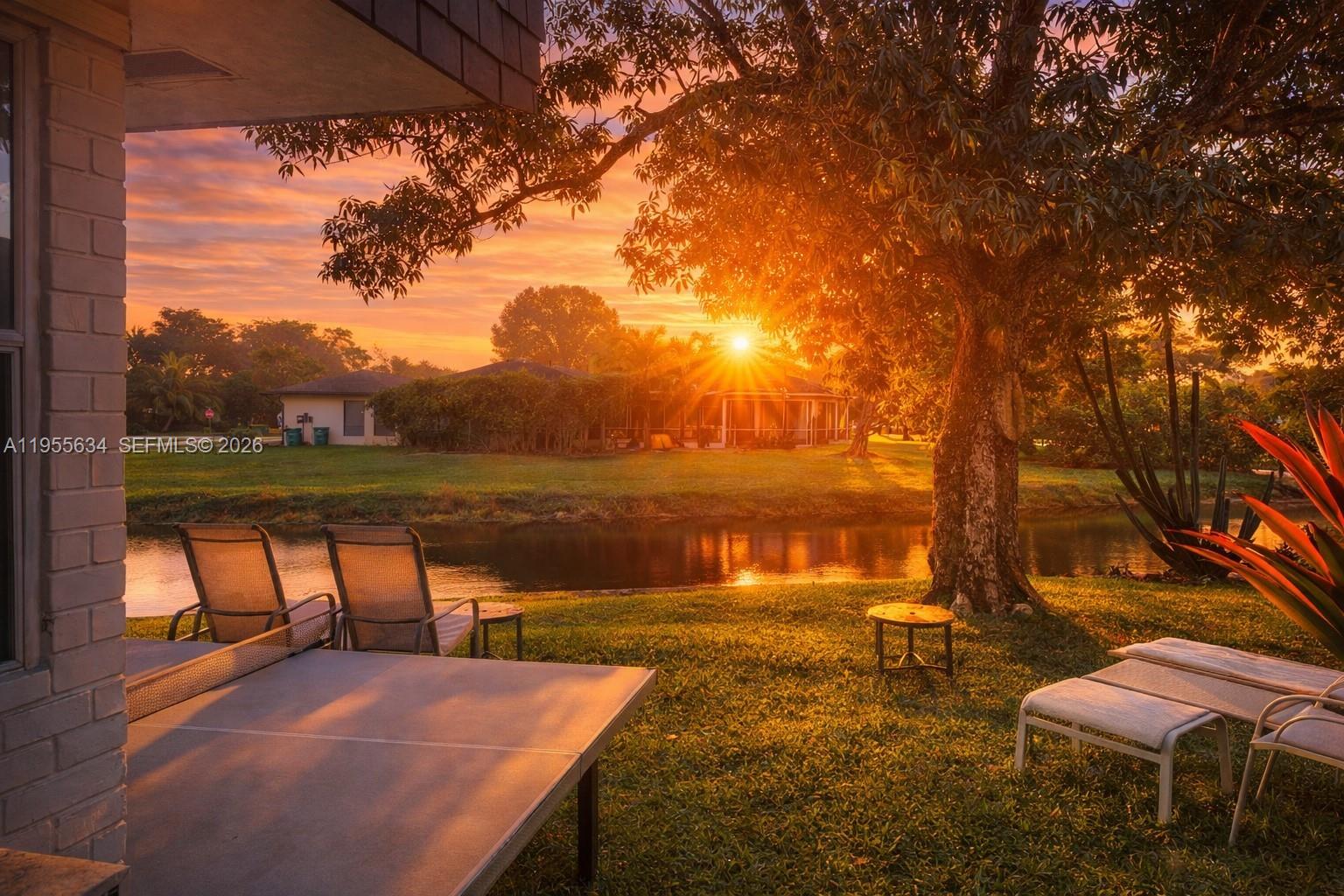 5700 White Hickory Circle Tamarac, FL 33319 - Photo 2 of 18 a view of a lake with a outdoor space