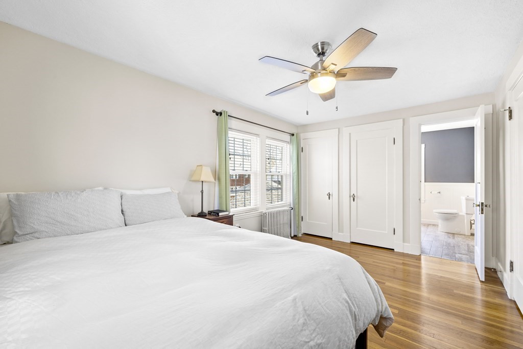 15 Pickwick Road Marblehead, MA 01945 - Photo 13 of 30 a bedroom with a large bed and a chandelier