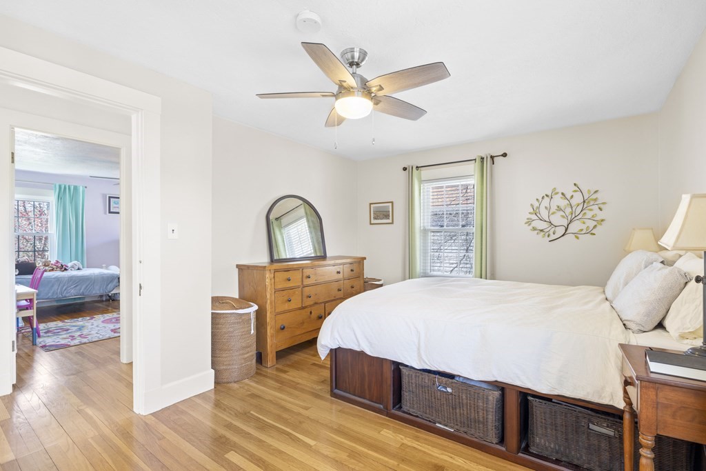 15 Pickwick Road Marblehead, MA 01945 - Photo 14 of 30 a bedroom with a bed and a chandelier