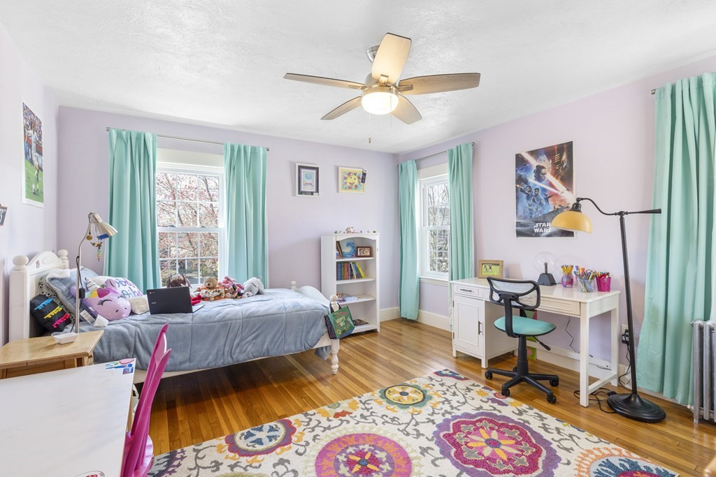 15 Pickwick Road Marblehead, MA 01945 - Photo 15 of 30 a bedroom with a bed and wooden floor
