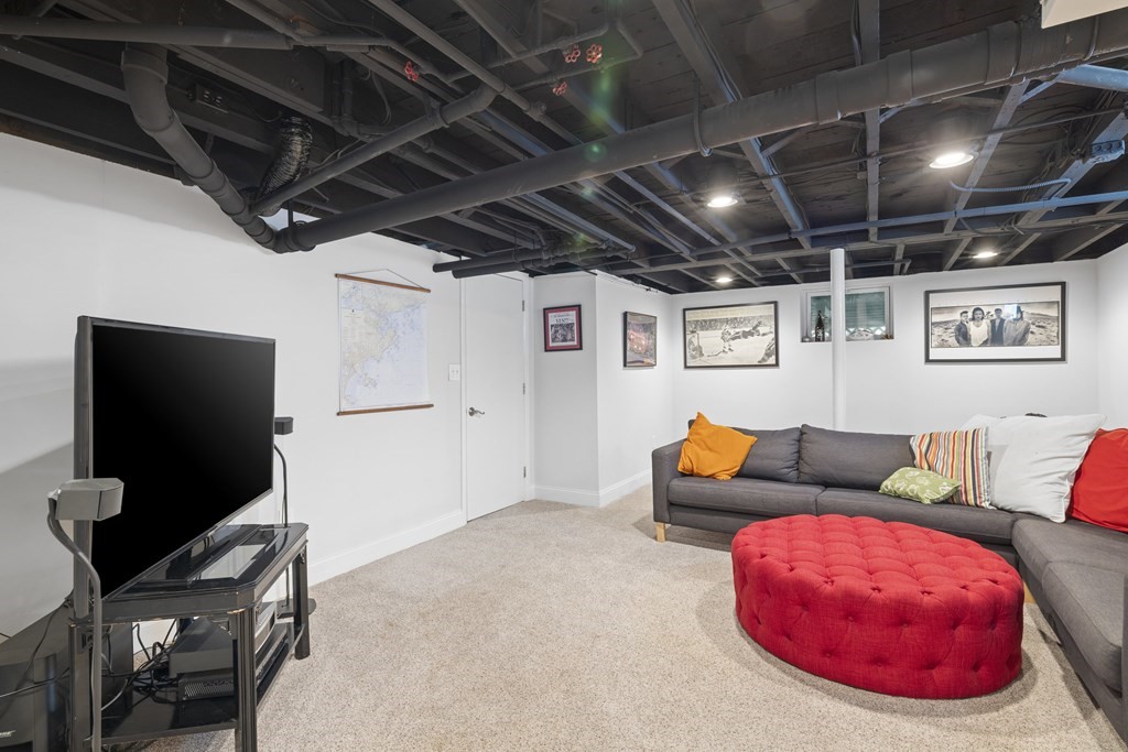 15 Pickwick Road Marblehead, MA 01945 - Photo 22 of 30 a living room with furniture and a flat screen tv