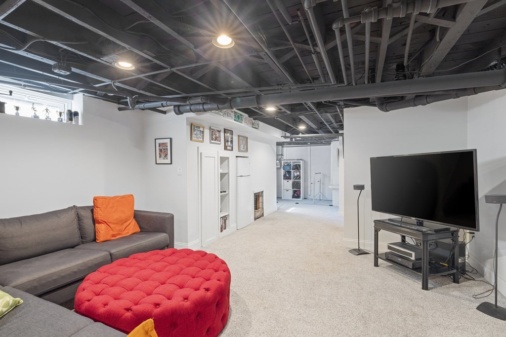 15 Pickwick Road Marblehead, MA 01945 - Photo 23 of 30 a living room with furniture and a flat screen tv