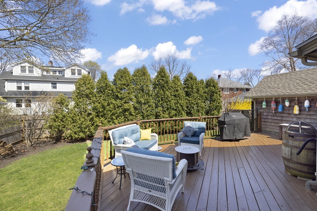 15 Pickwick Road Marblehead, MA 01945 - Photo 25 of 30 a view of a patio with couches table and chairs and potted plants