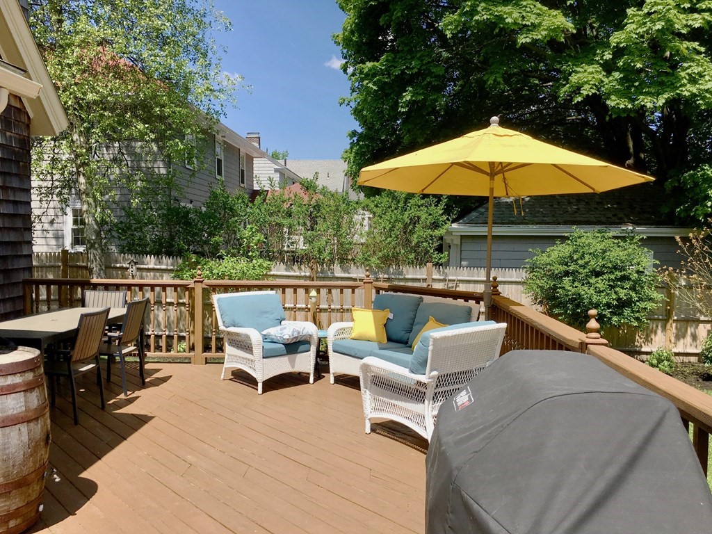 15 Pickwick Road Marblehead, MA 01945 - Photo 26 of 30 an outdoor sitting area with furniture and umbrella