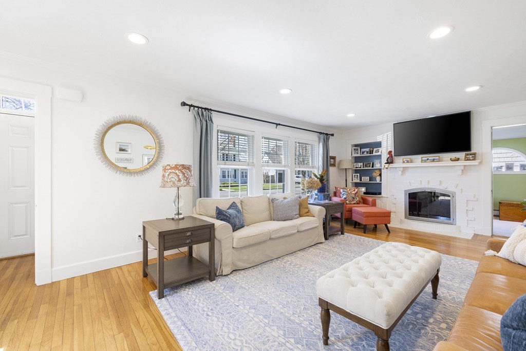 15 Pickwick Road Marblehead, MA 01945 - Photo 5 of 30 a living room with furniture a fireplace and a flat screen tv