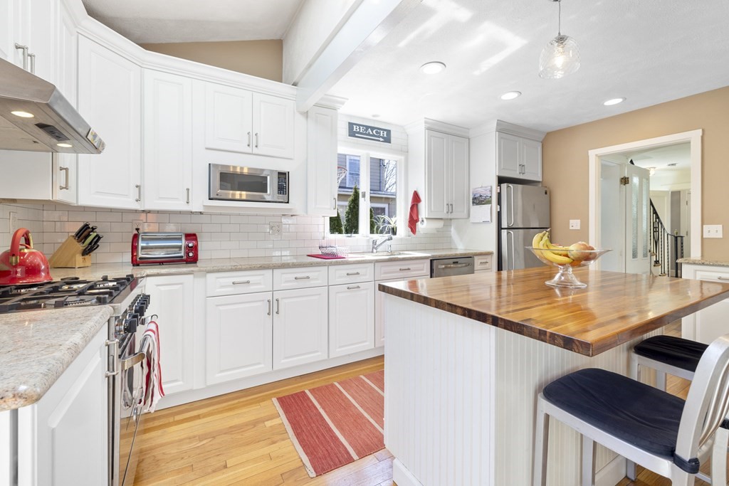 15 Pickwick Road Marblehead, MA 01945 - Photo 7 of 30 a kitchen with stainless steel appliances granite countertop a sink stove and cabinets