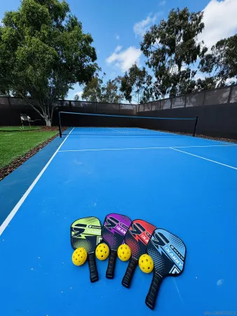 a view of outdoor space with pool table and chairs