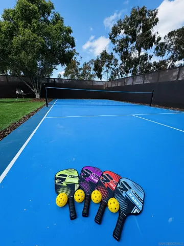 a view of outdoor space with pool table and chairs