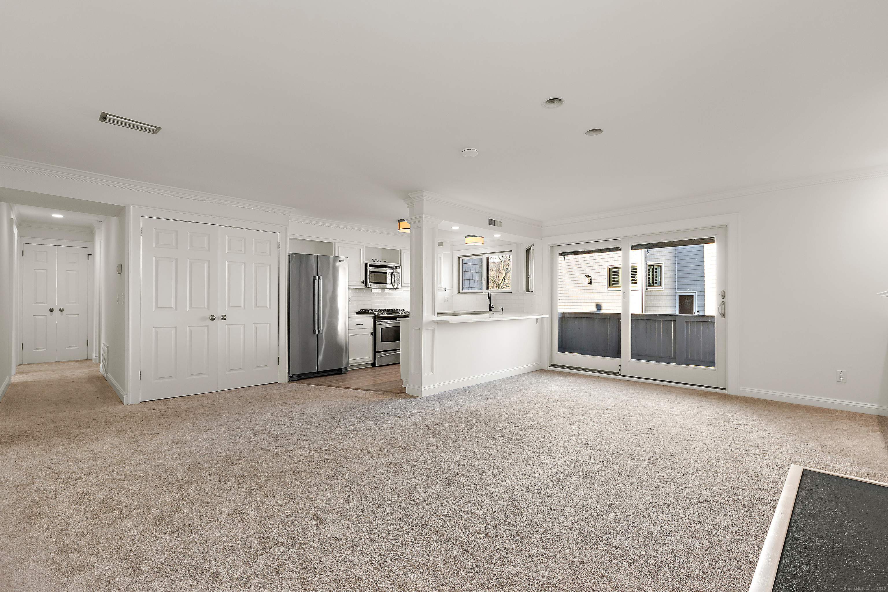 133 Rowayton Woods Drive, Unit 133 Norwalk, CT 06854 - Photo 11 of 40 Dining area and Living Room looking into Kitchen