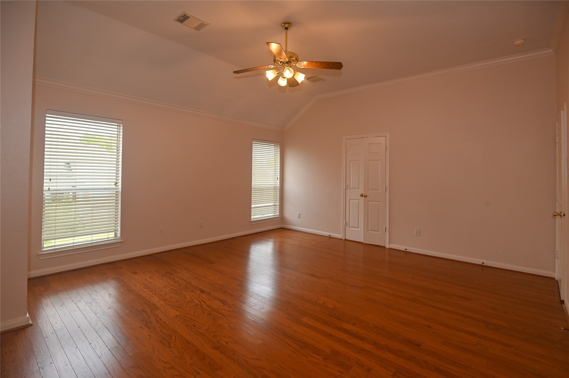 3023 Hidden Mist Court Pearland, TX 77584 - Photo 14 of 24 a view of an empty room with wooden floor and a window