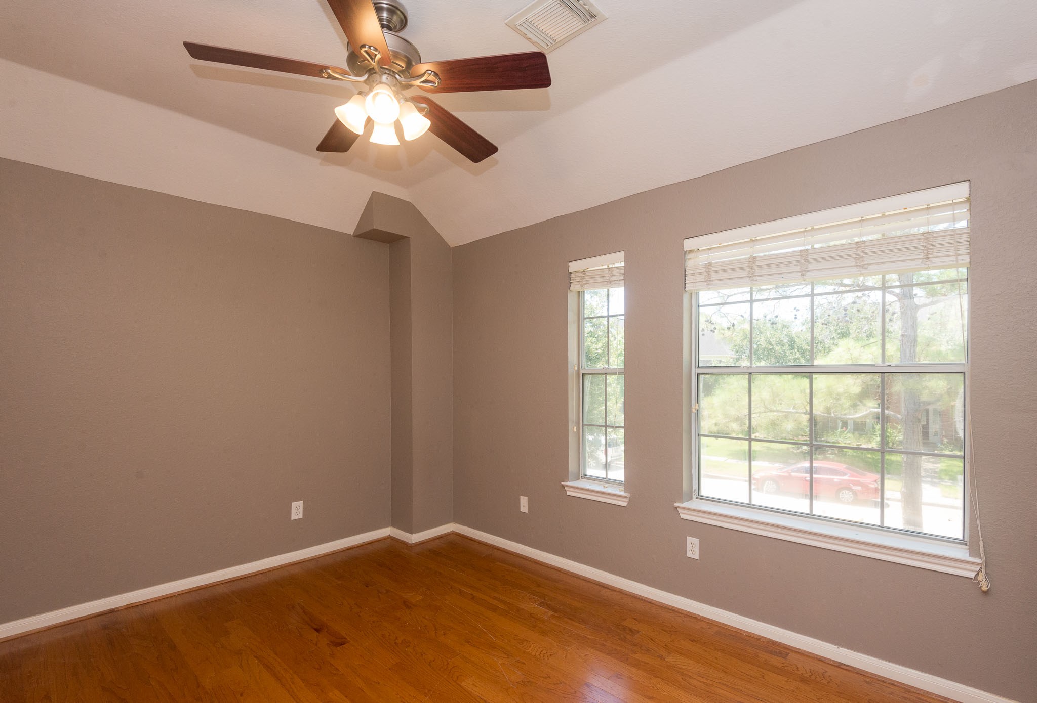3023 Hidden Mist Court Pearland, TX 77584 - Photo 21 of 24 a view of an empty room with window and chandelier fan