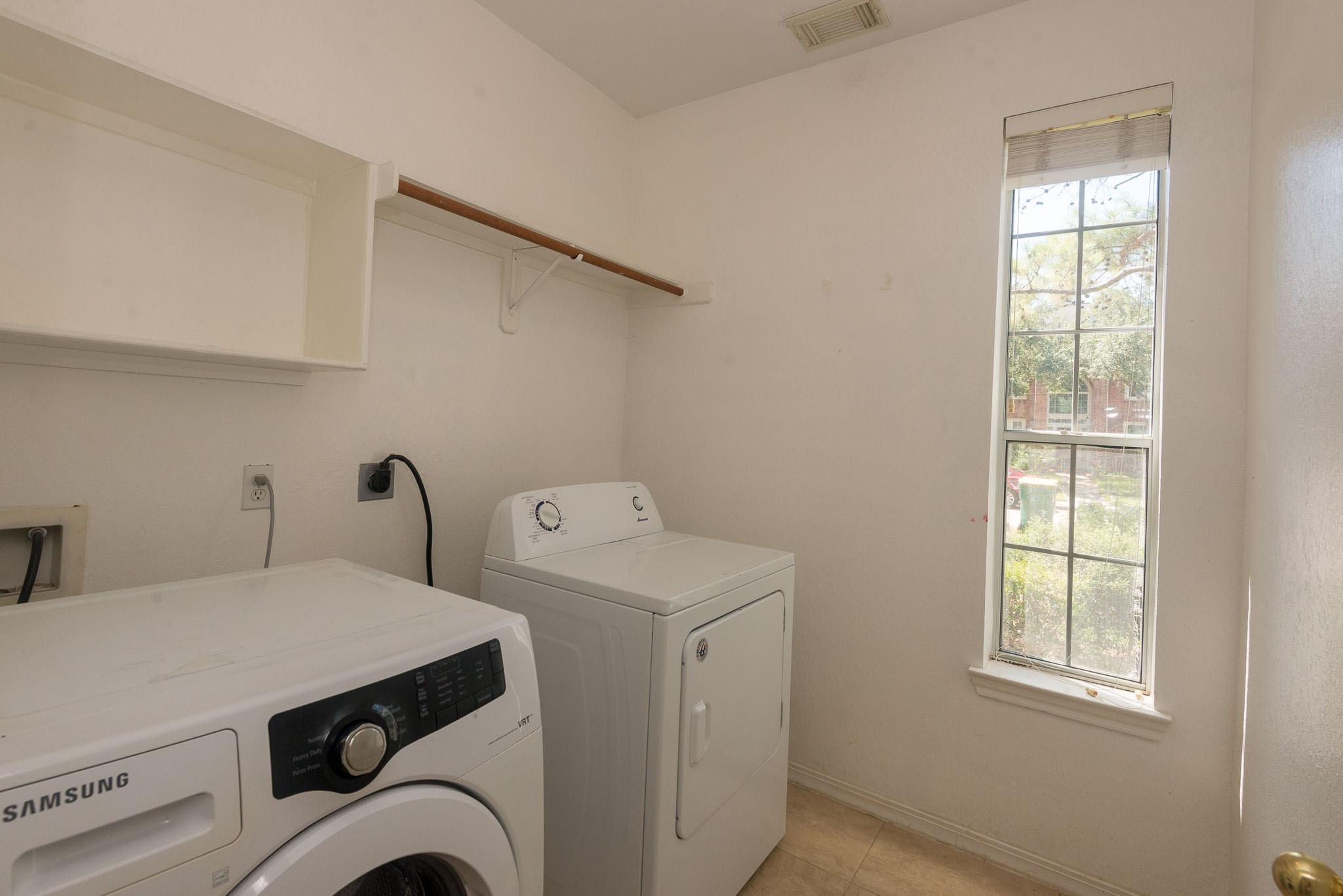 3023 Hidden Mist Court Pearland, TX 77584 - Photo 23 of 24 a utility room with dryer and washer