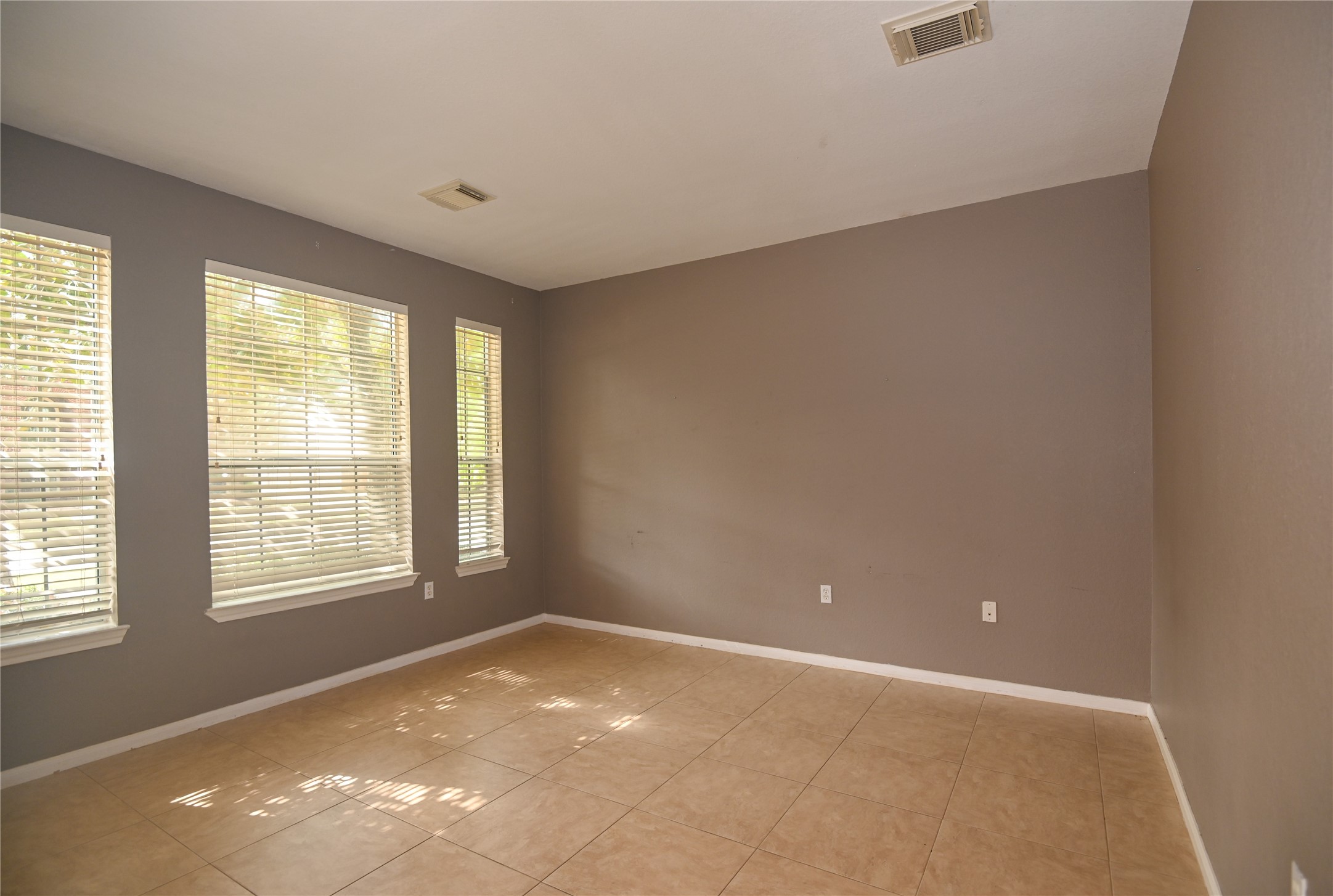 3023 Hidden Mist Court Pearland, TX 77584 - Photo 5 of 24 a view of an empty room with a window