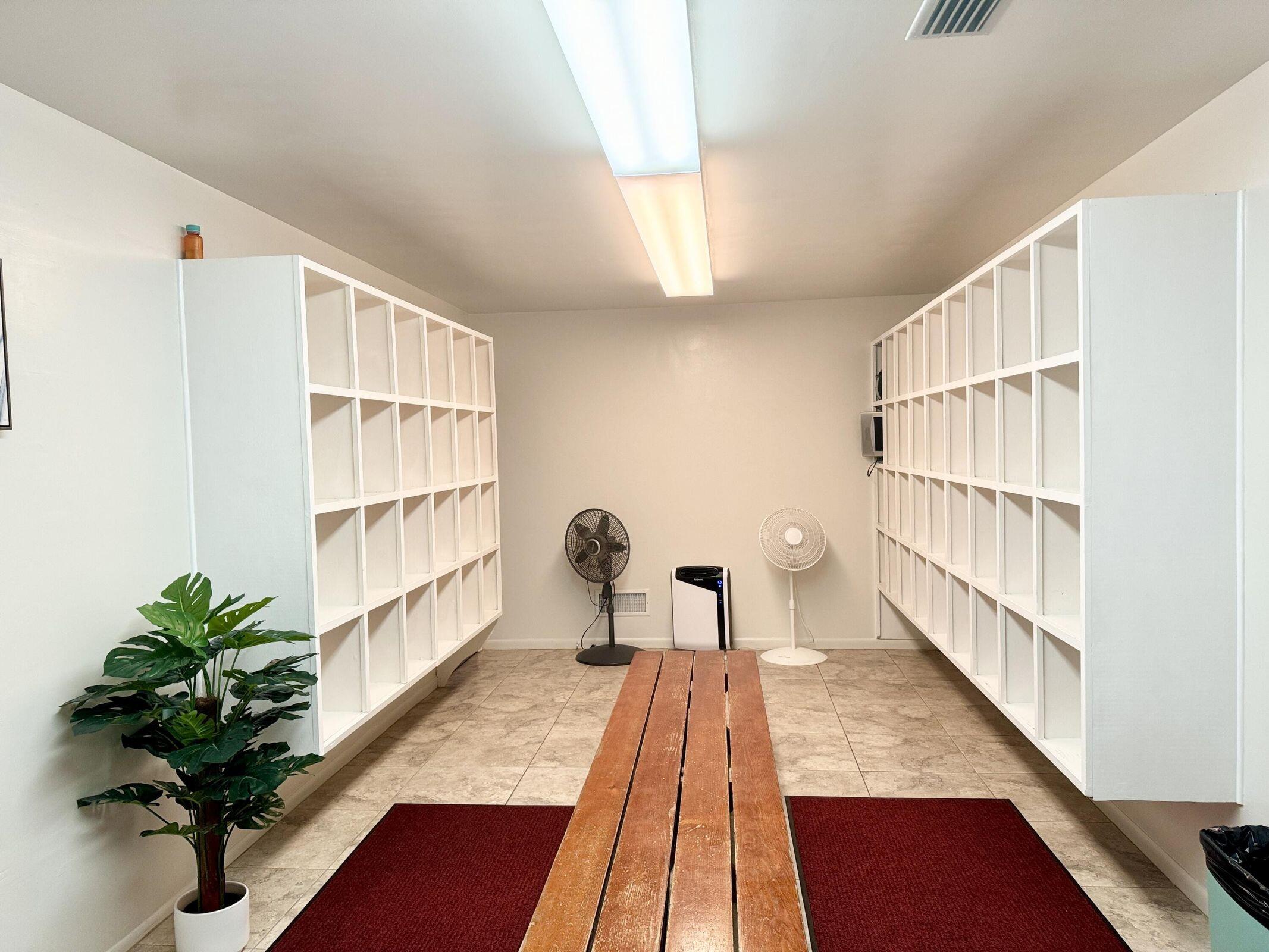 3040 Lake Osborne Drive, Unit 108 Lake Worth Beach, FL 33461 - Photo 20 of 27 a living room with furniture and a book shelf